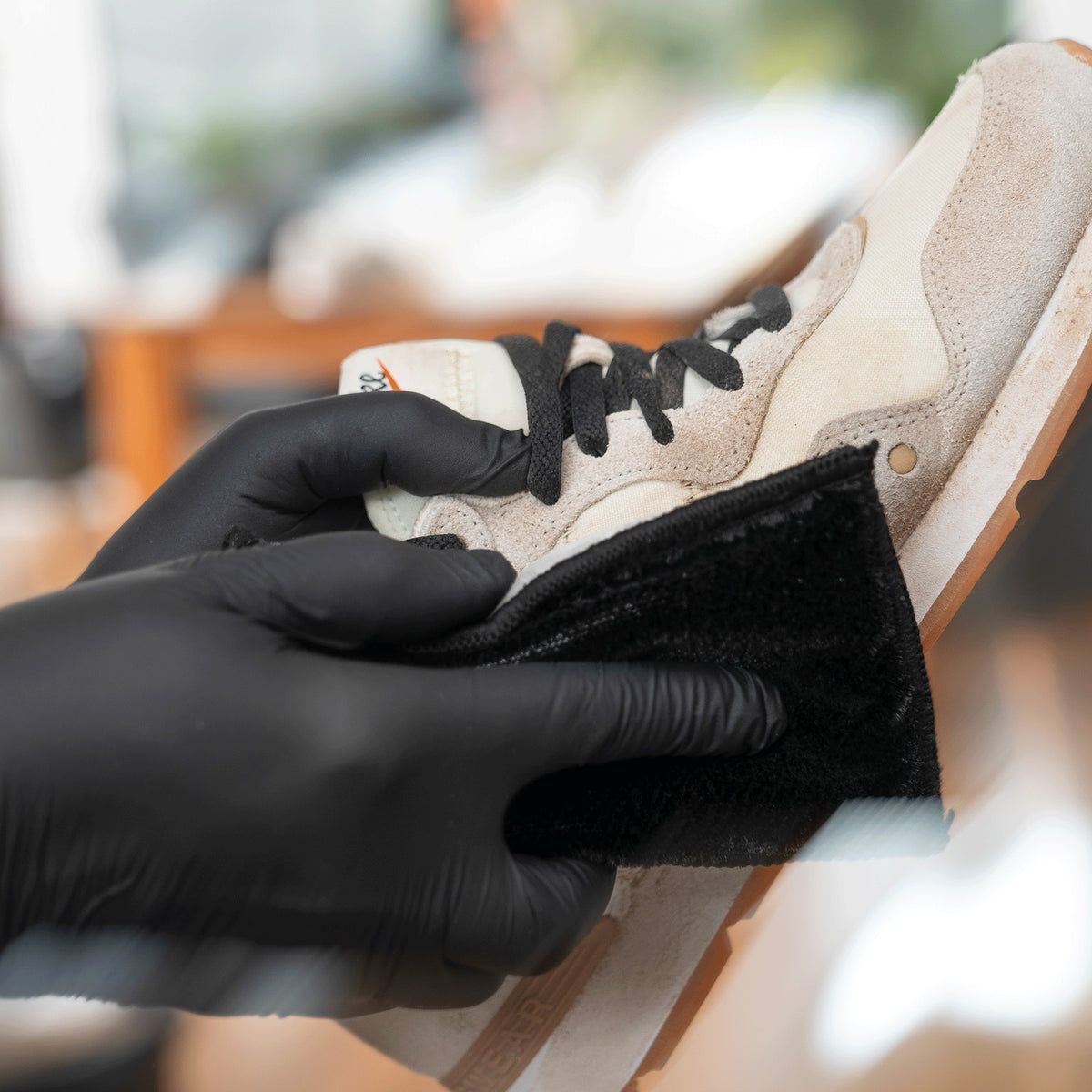 Detailing1 COLOURLOCK Sneaker Cleaner — cleaning a light-coloured sneaker with the cleaning pad
